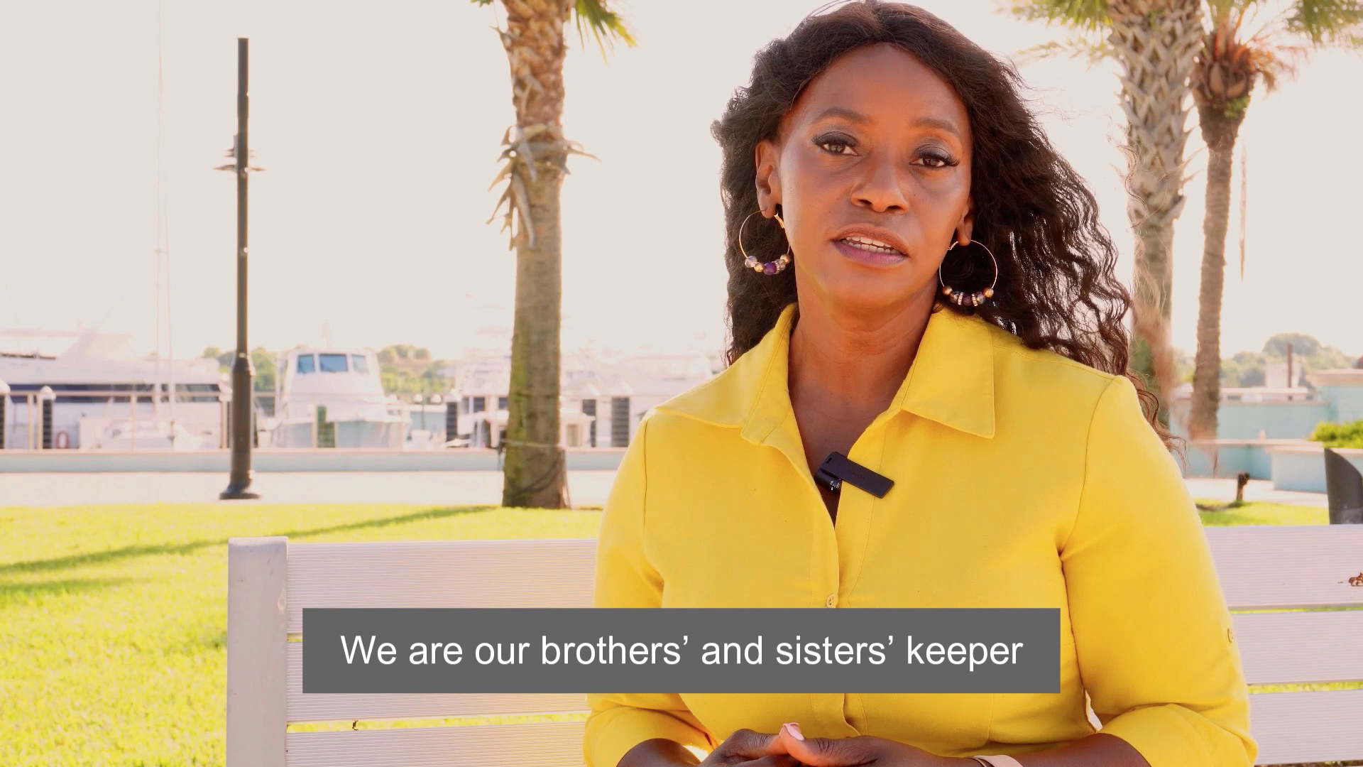 close up image of black woman in yellow dress