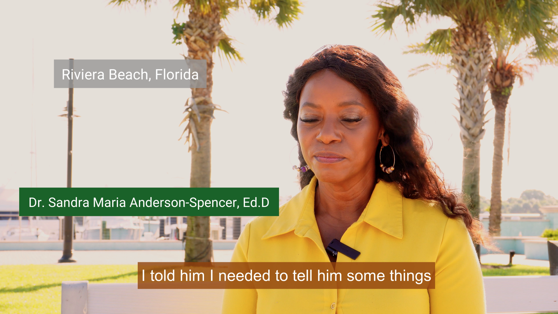 close up image of black woman in yellow dress