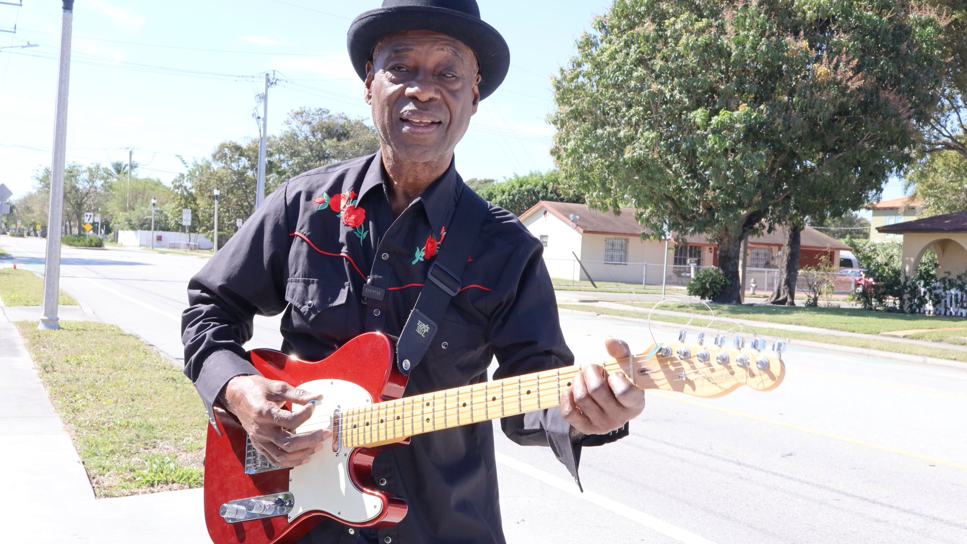 close up image of black woman in yellow dress